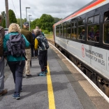 A group of walkers catching a train.